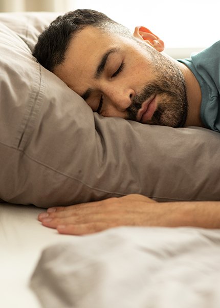 Man sleeping peacefully in bed