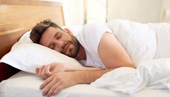 Man sleeping peacefully in bed