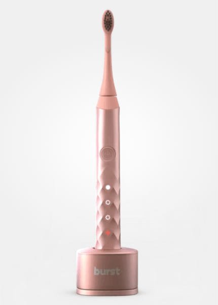Burst toothbrush in rose gold against neutral background