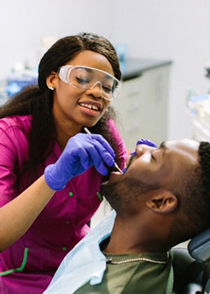 Young man receiving dental cleaning in South Portland