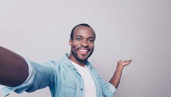 man smiling after deciding which cosmetic procedure was right for him