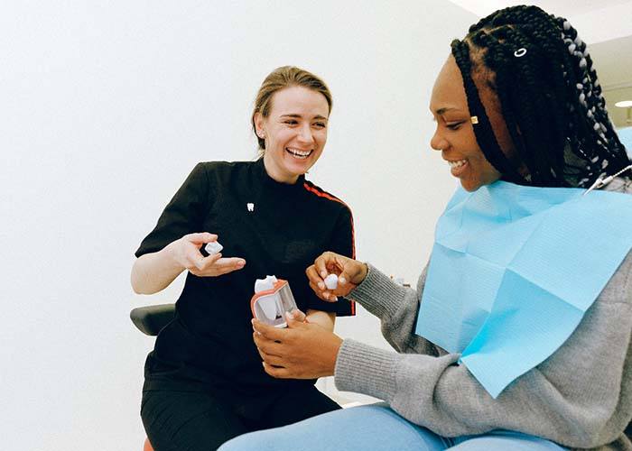 Woman at consultation for dental crowns in South Portland