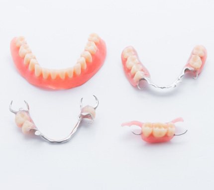 Sets of dentures against a white background