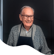 Older man with hybrid dentures smiling