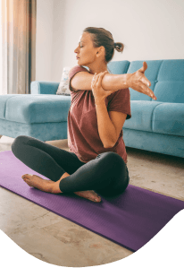 Woman doing yoga in her home