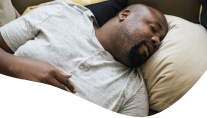 Man with nightguard sleeping soundly