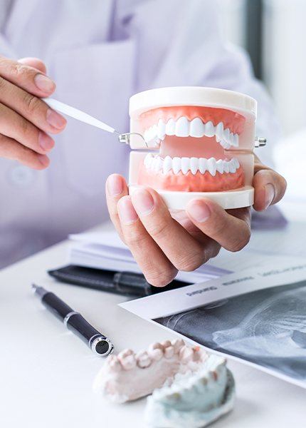 Dentist and patient reviewing dental treatment plan