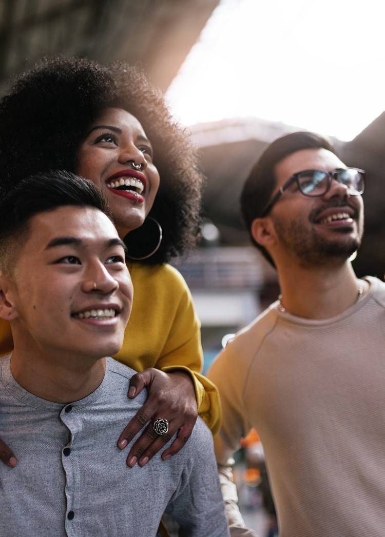 three people smiling together