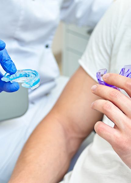 dentist and patient holding dental trays