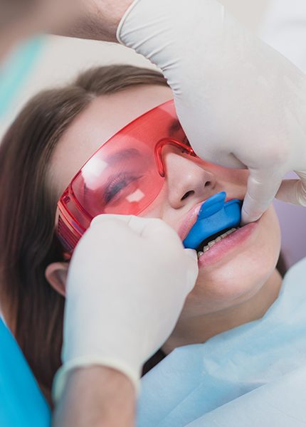 Patient receiving fluoride treatment