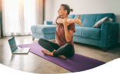 Woman doing yoga in her home