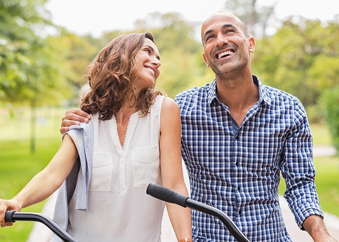 Man and woman on a bike ride filled with energy thanks to sleep apnea treatment