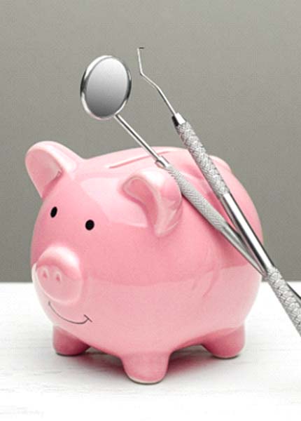 piggy bank next to dental tools showing the cost of Sure Smiles in South Portland