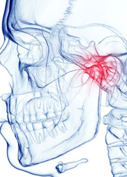 TMJ highlighted on illustration of human skull