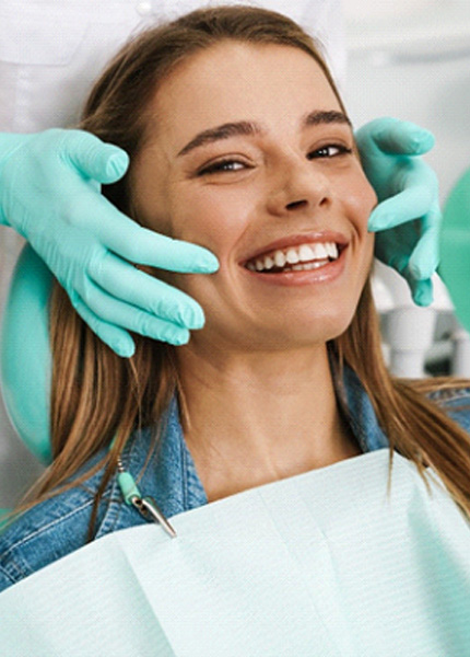 a patient in South Portland smiling after receiving veneers