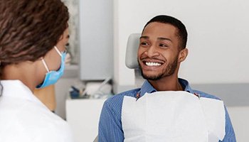 a patient visiting his dentist for teeth whitening in South Portland, ME