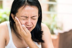 woman with jaw pain caused by TMJ disorder in South Portland 