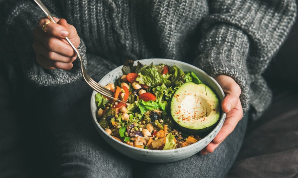 Closeup of bowl filled with plant-based ingredients