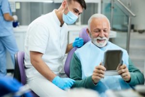 happy senior at the dentist’s office using a dental membership plan